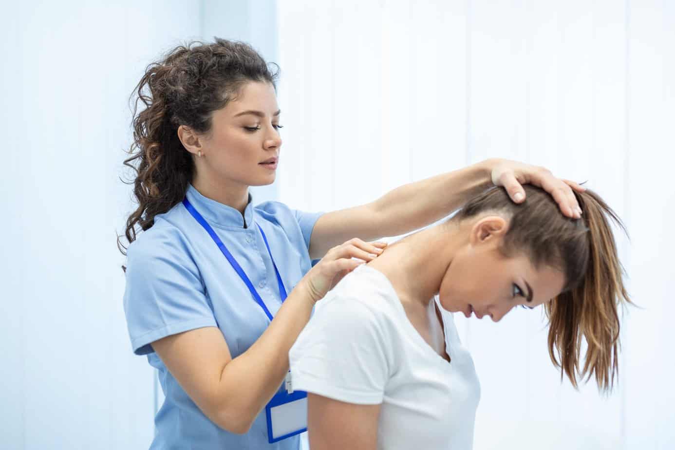 licensed-chiropractor-manual-therapist-doing-neck-stretch-massage-relaxed-female-patient-clinic-office-young-woman-with-whiplash-rheumatological-problem-getting-professional-doctor-s-help